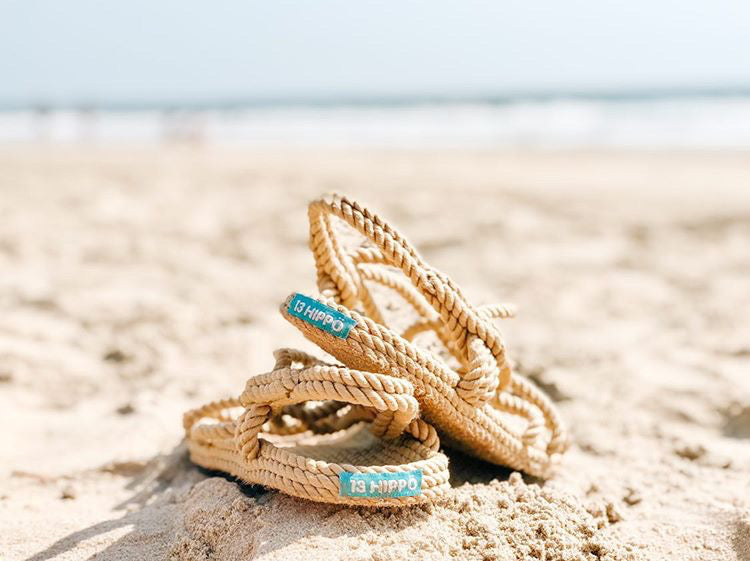 HIPPÖ rope sandals on a beach