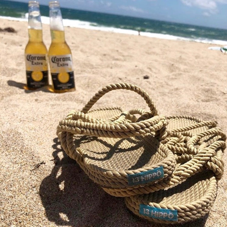 vegan rope sandals on a beach with beer 